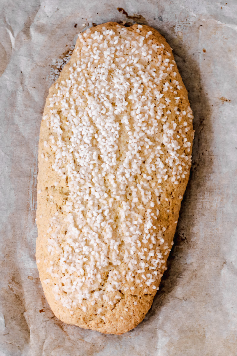 image of a baked dough with pearl sugar on top. 