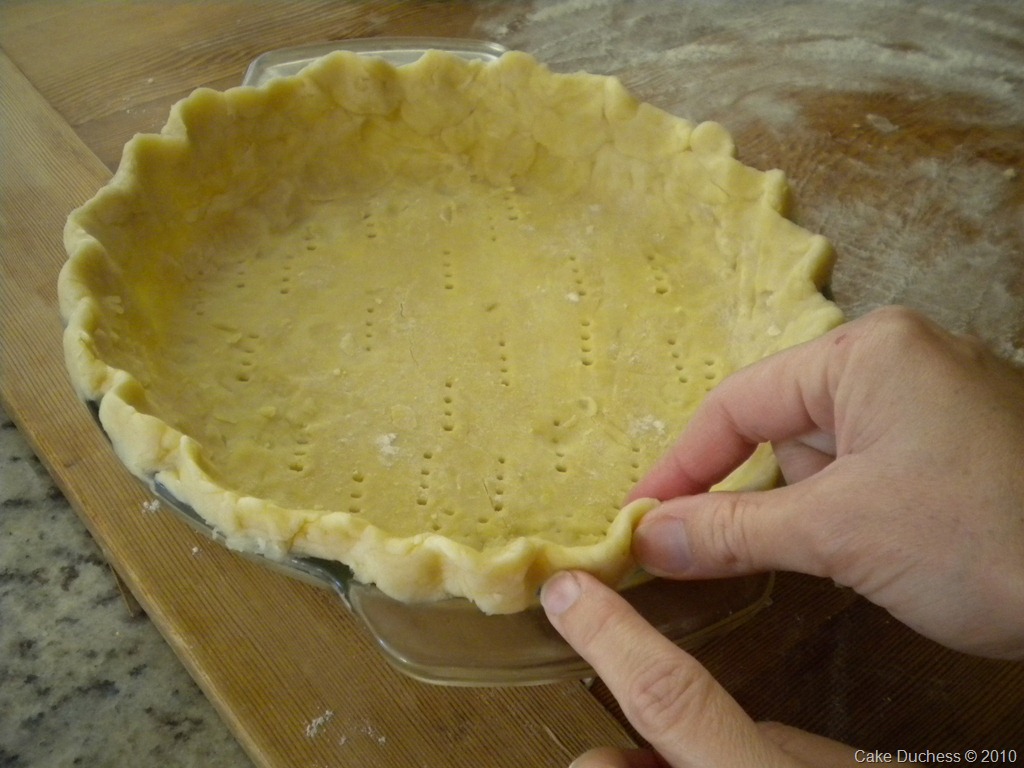 overhead image of crimping pie crust