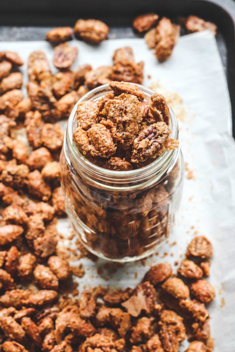 overhead image of nuts in a glass jar.