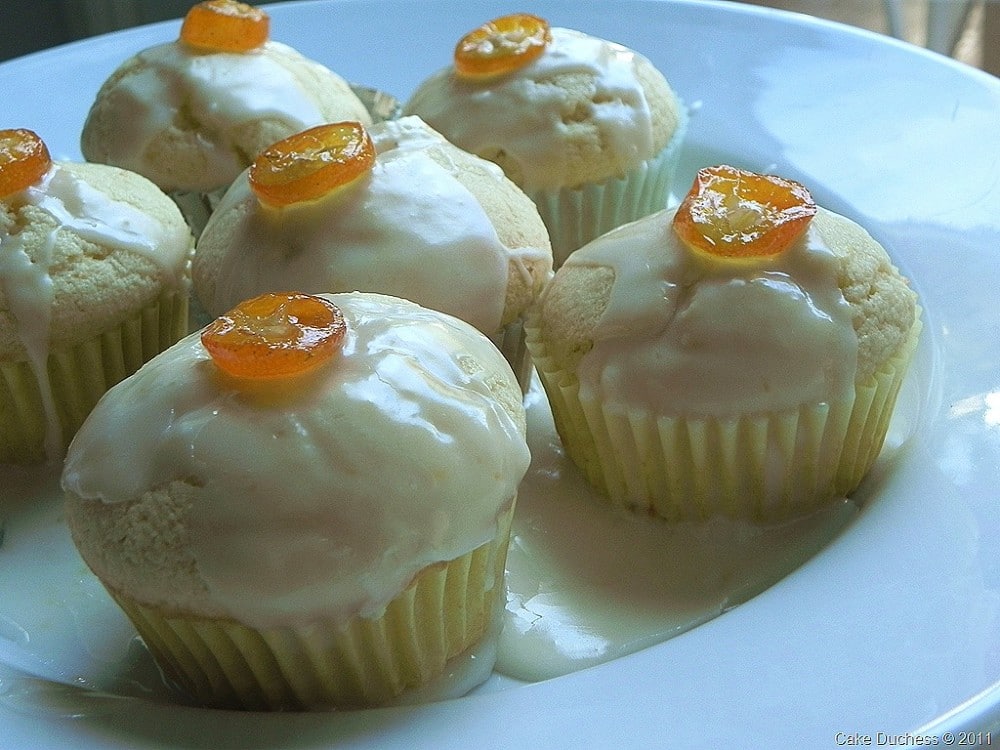 image of kumquat ricotta cupcakes on a white plate