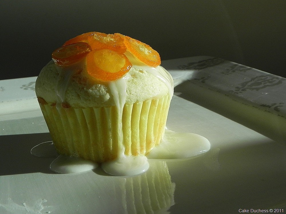 image of kumquat ricotta cupcake on a white plate