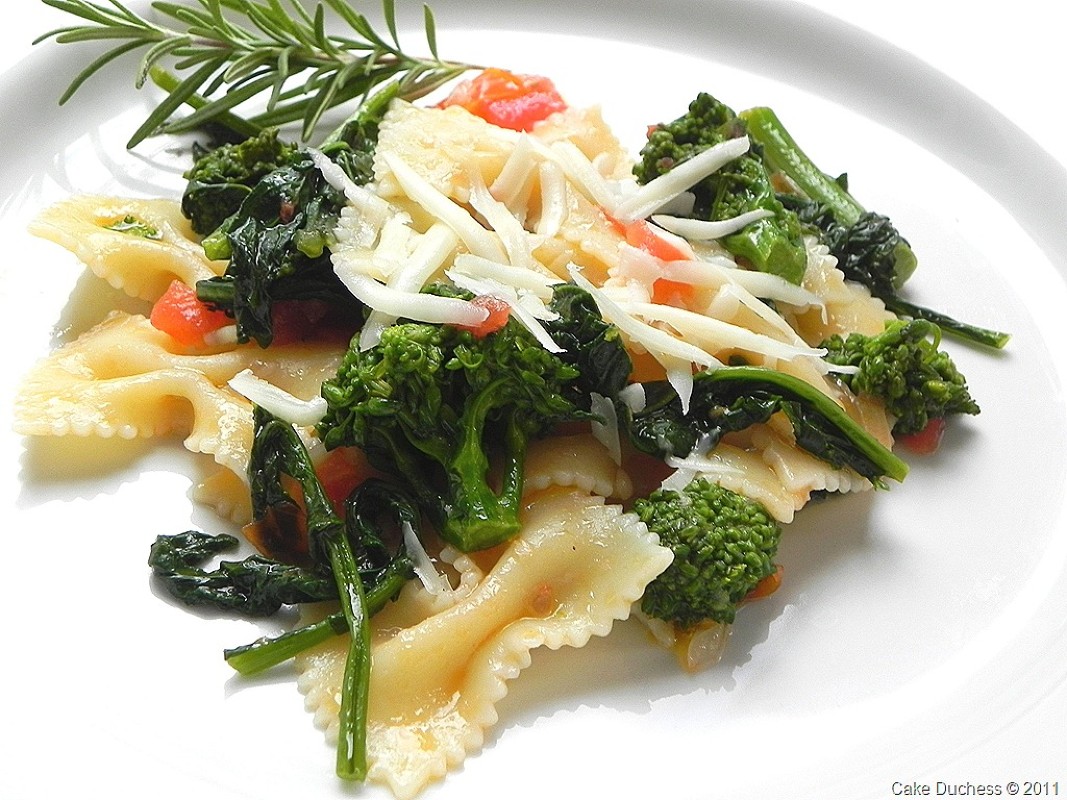 overhead image of pasta on a plate with vegetables