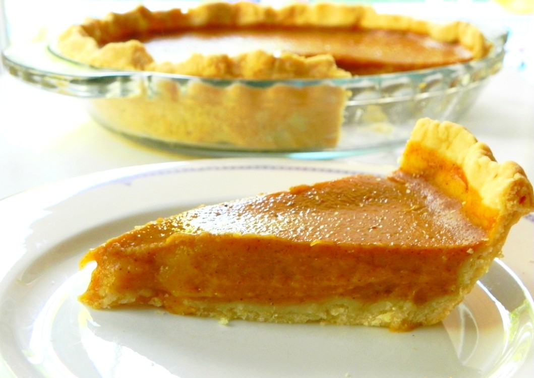 image of slice of vegan maple pumpkin pie on white dish