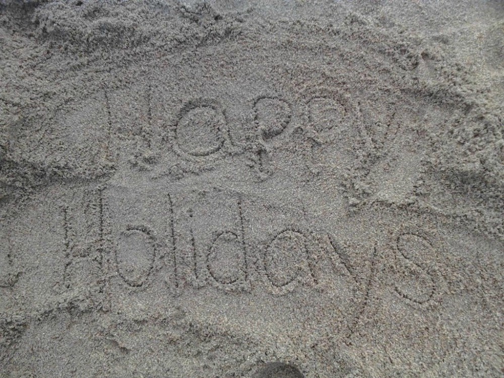 image of a message written on sand