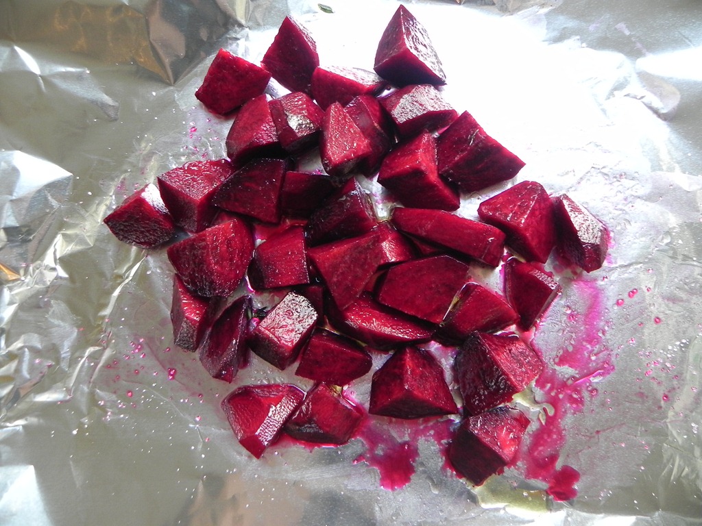 overhead image of chunks of beets on foil paper