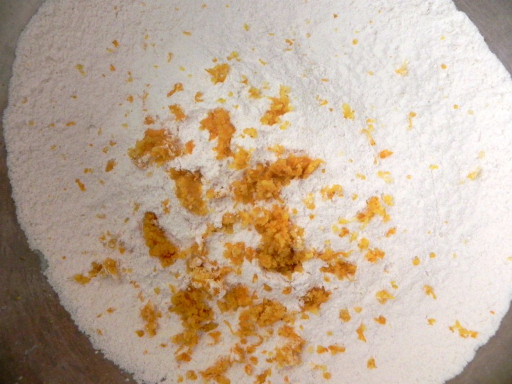 overhead image of flour with citrus rind