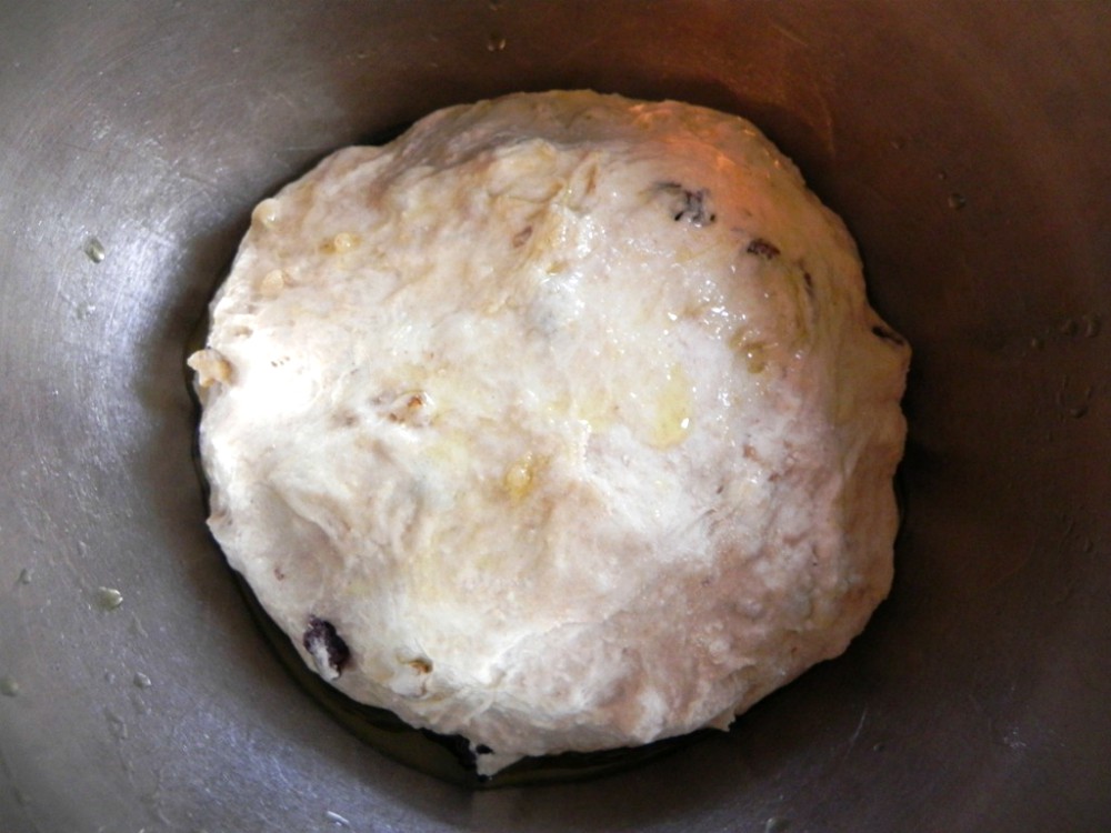 overhead image of dough in metal bowl