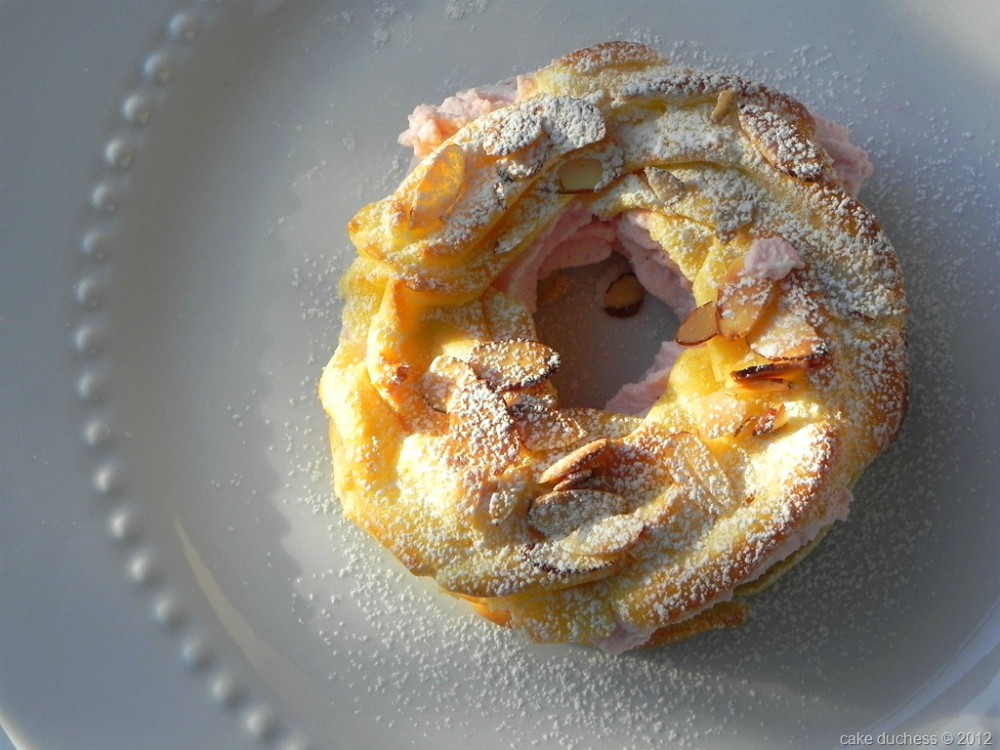 overhead image of pastry with powdered sugar on white plate