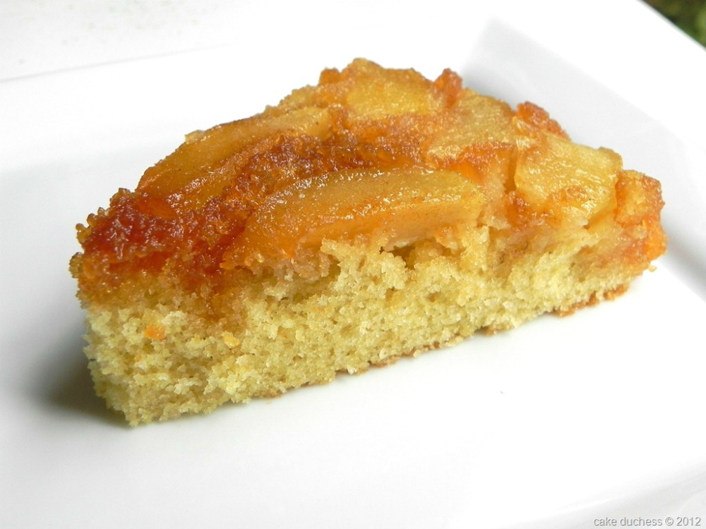 image of a slice of apple cake on a white plate. 