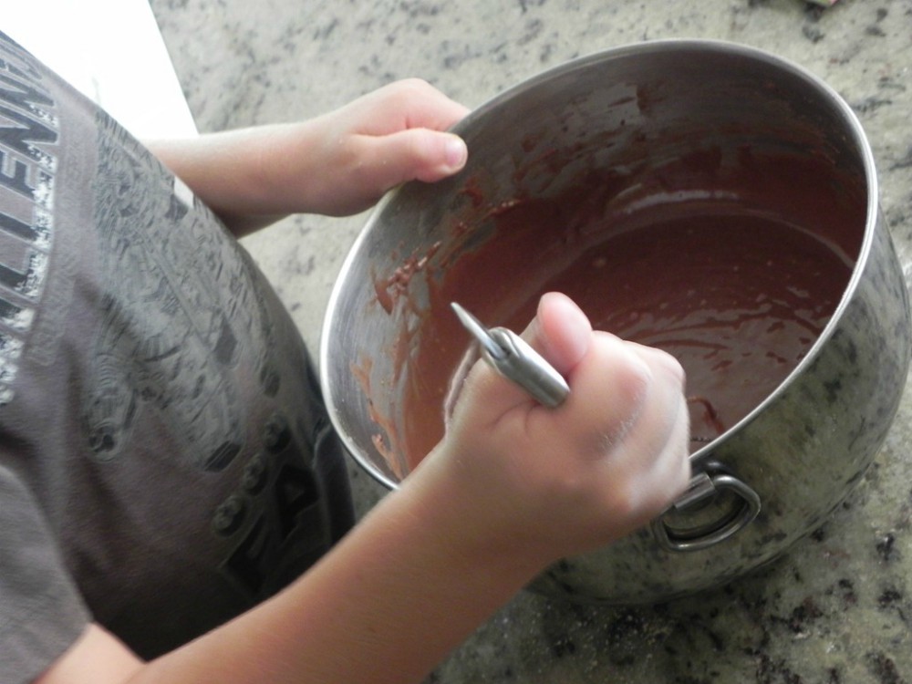 overhead image of mixing chocolate batter in metal bowl