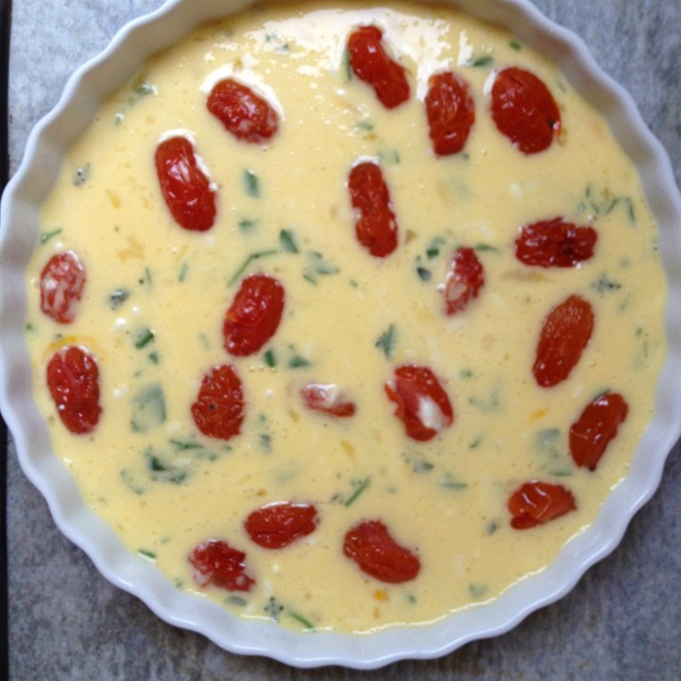 overhead image of clafoutis with tomatoes