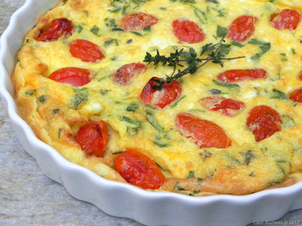 overhead image of savory roasted tomato and manchego cheese clafoutis