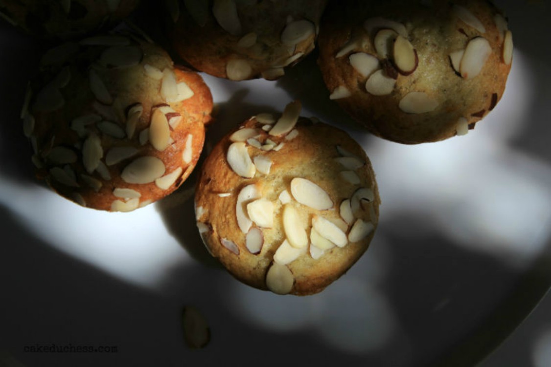 overhead image of muffins with almond slices