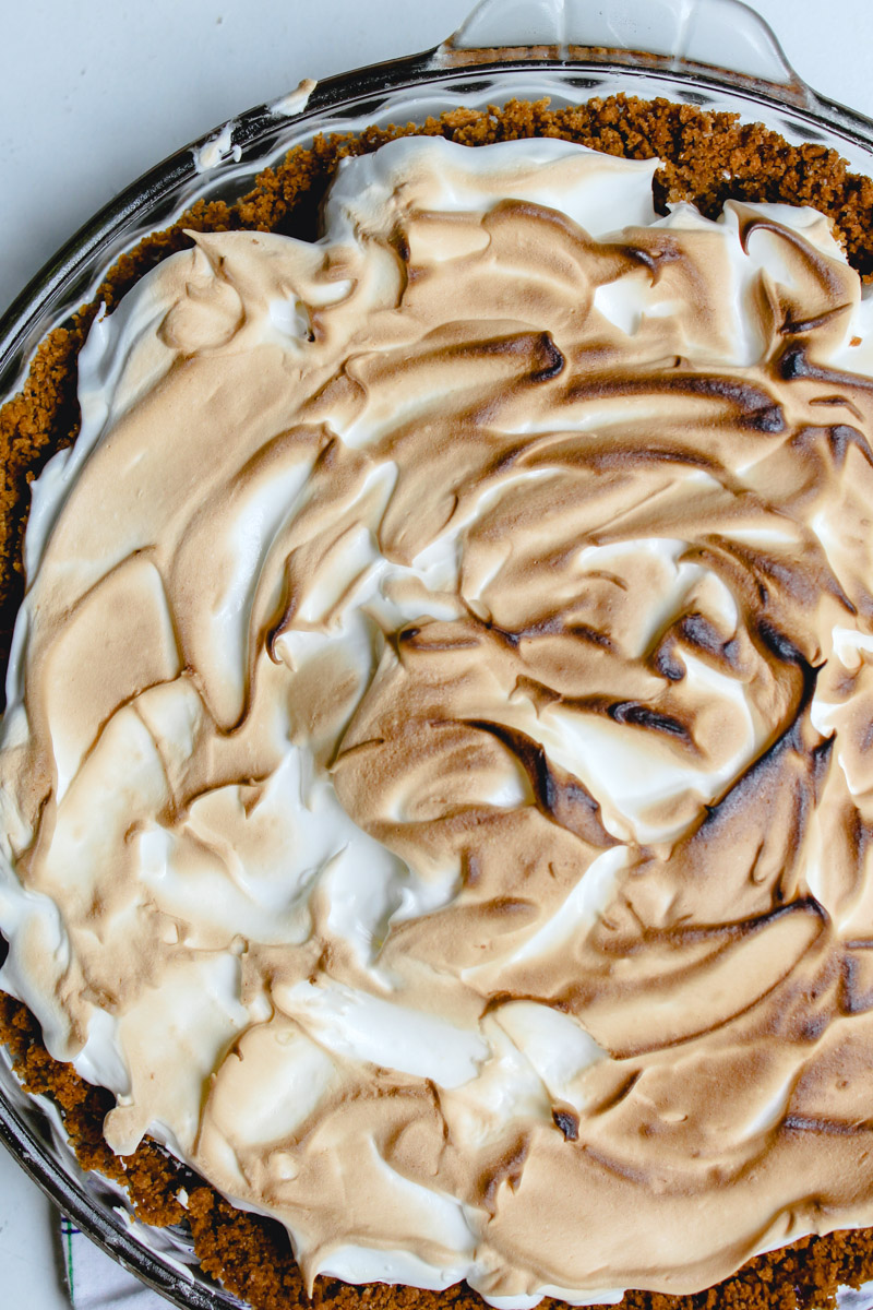 overhead image of key lime pie in a pie plate.