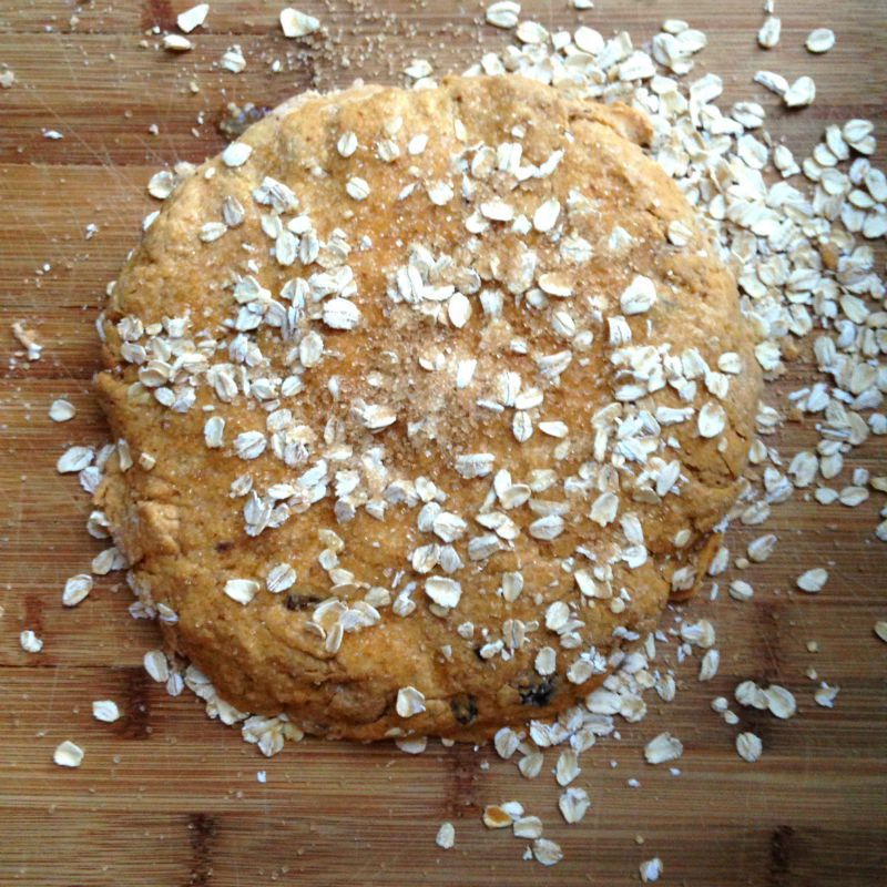 overhead image of dough with oats sprinkled on top
