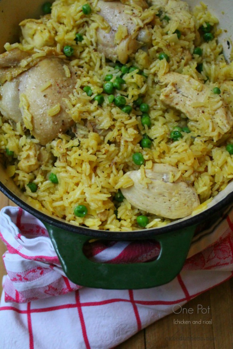 overhead image of chicken and rice in green pot