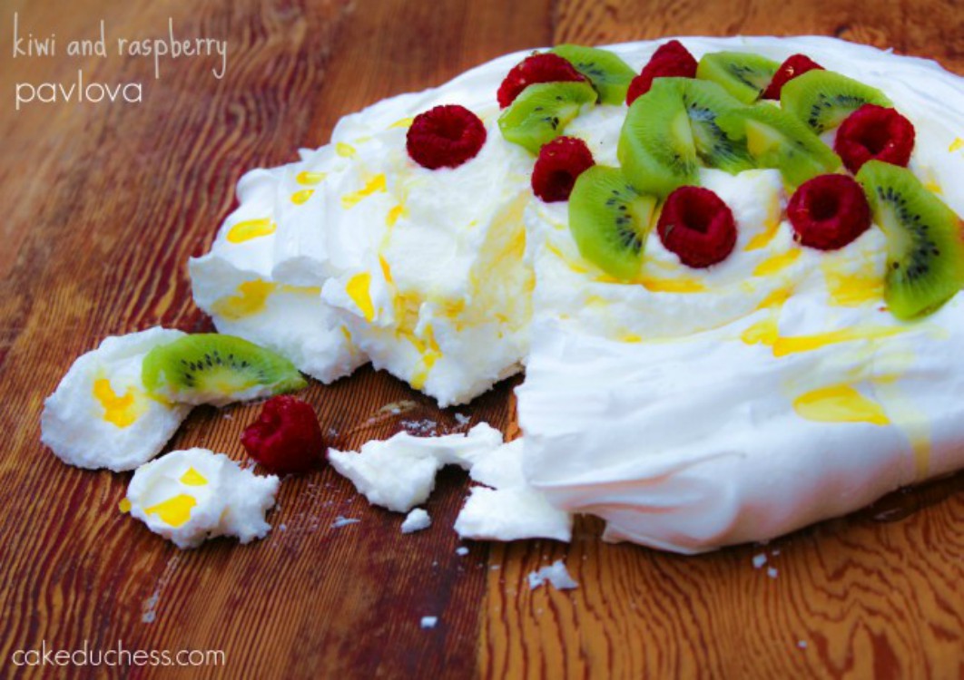 overhead image of kiwi and raspberry pavlova