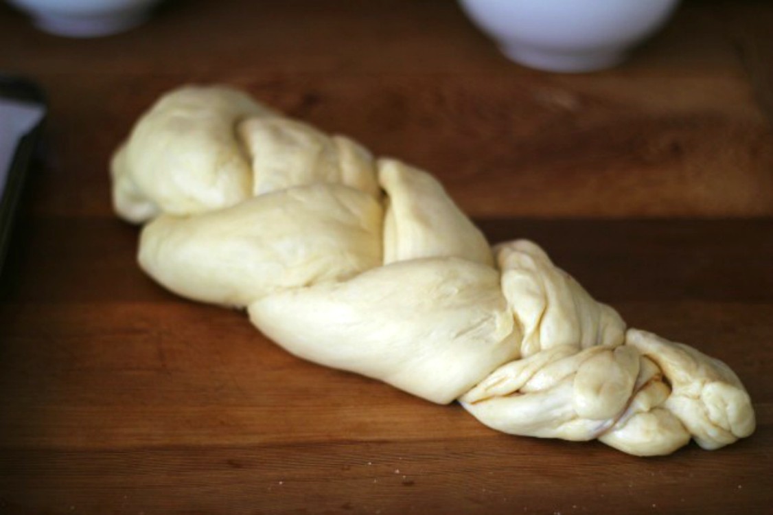 overhead image of challah braided loaf before baking