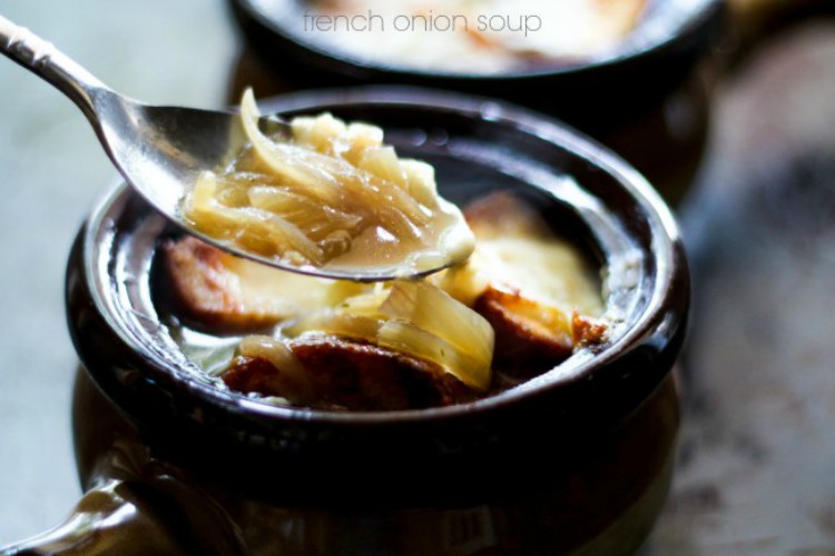 overhead image of onion soup in brown bowl