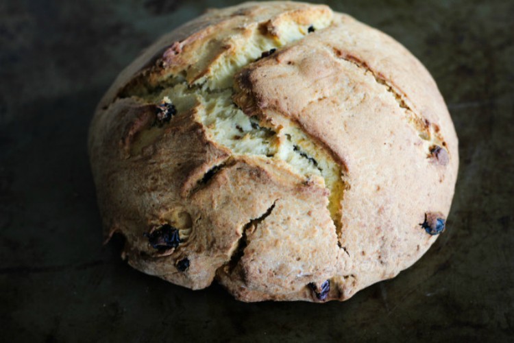 overhead image of round bread on baking tray