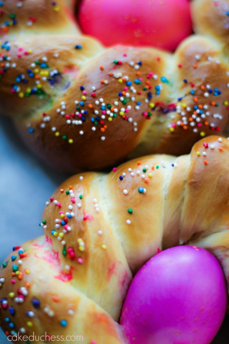 overhead image of colored eggs in braided bread