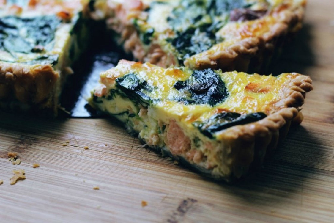 overhead image of slice of egg tart with spinach