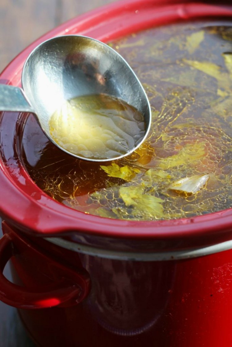 overhead image of broth in a slow cooker