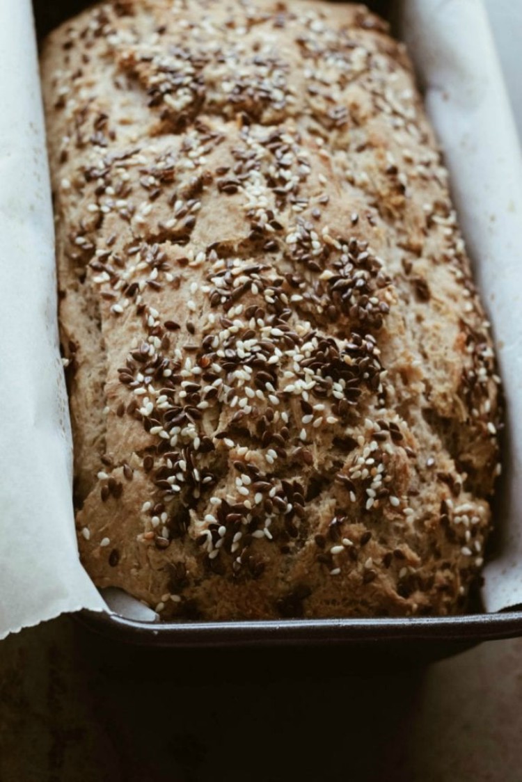 overhead image of loaf of bread with seeds on top