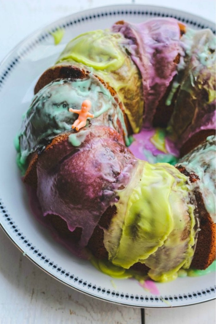 overhead image of colorful bundt cake on a white plate.