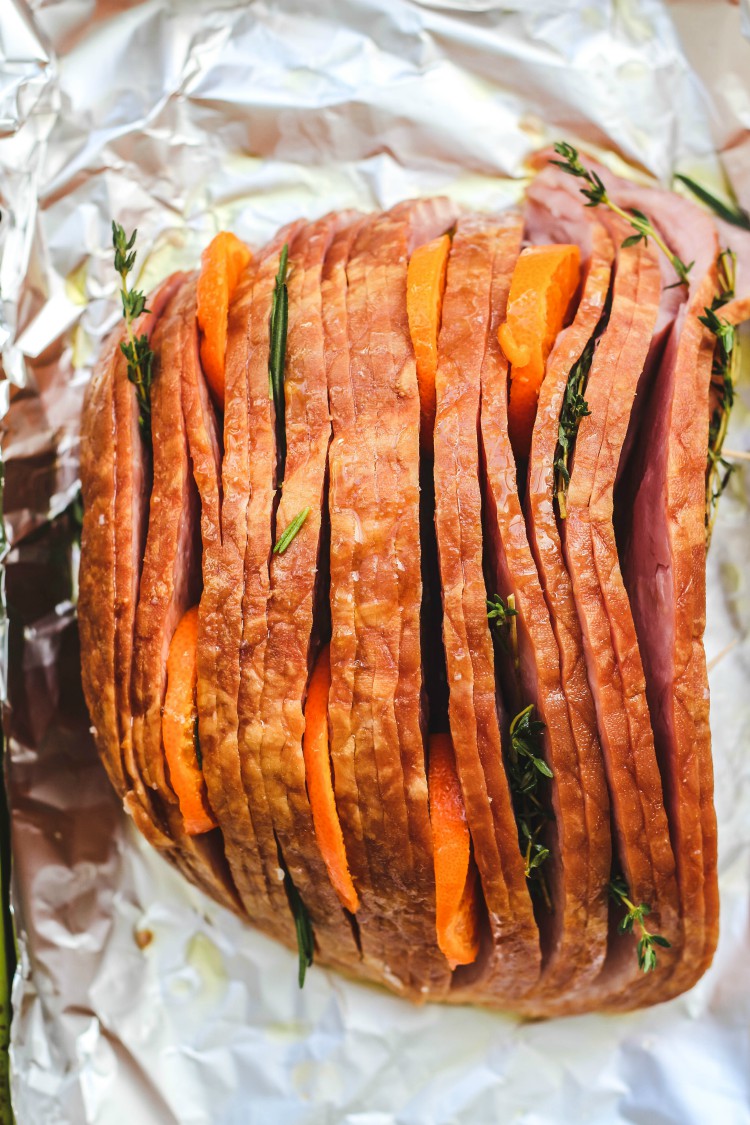 overhead image of sliced ham on foil paper.