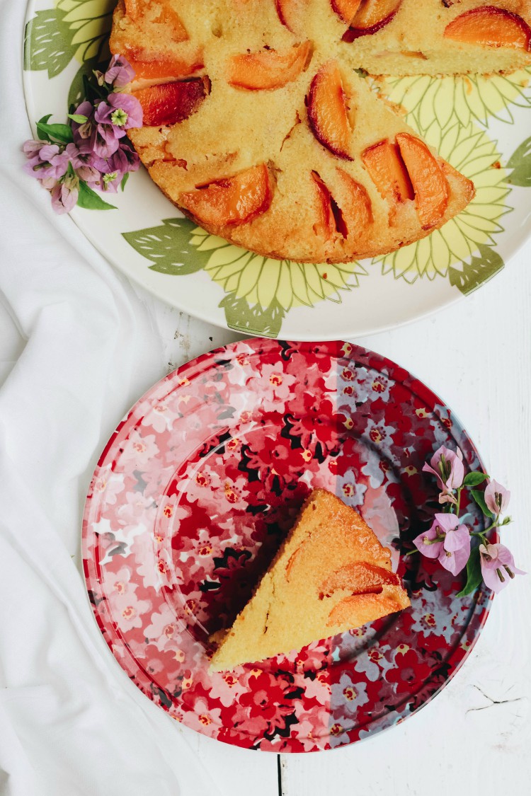 overhead image of peach polenta cake.