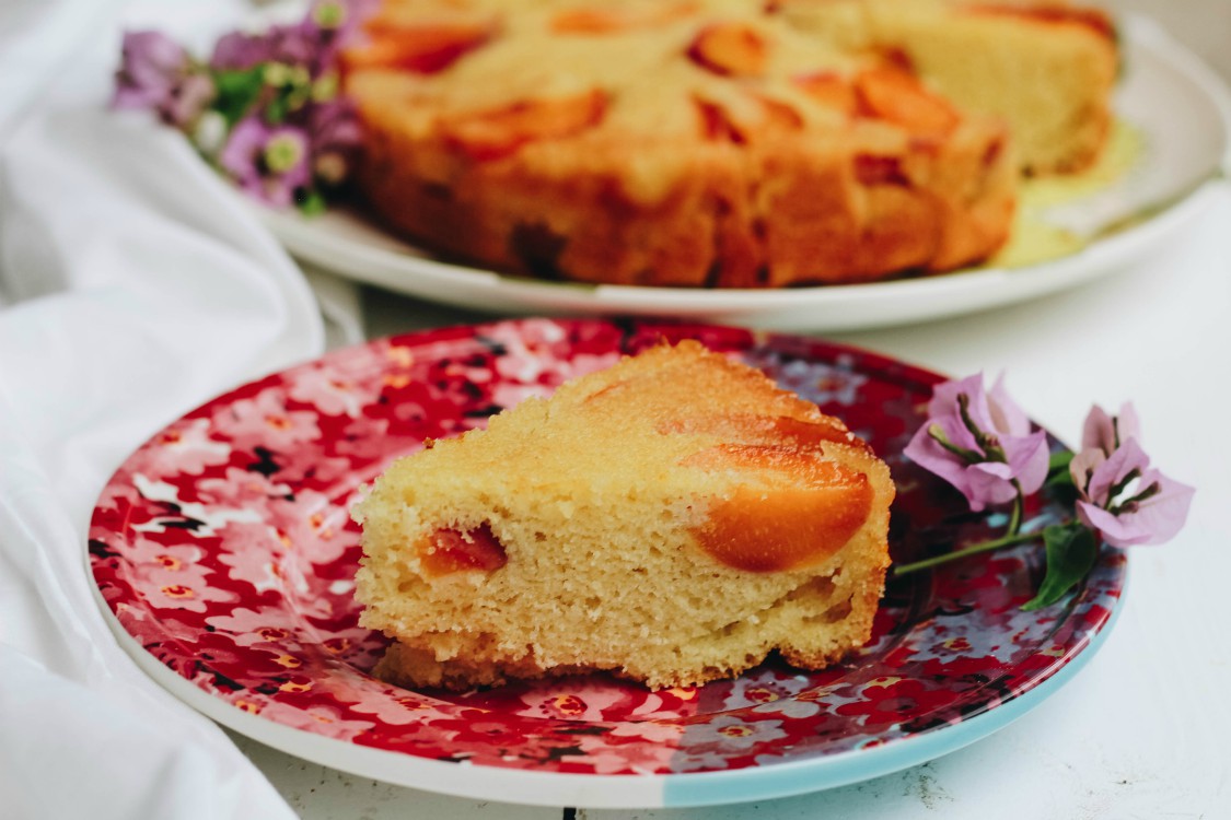 image of a slice of cake on a red plate.