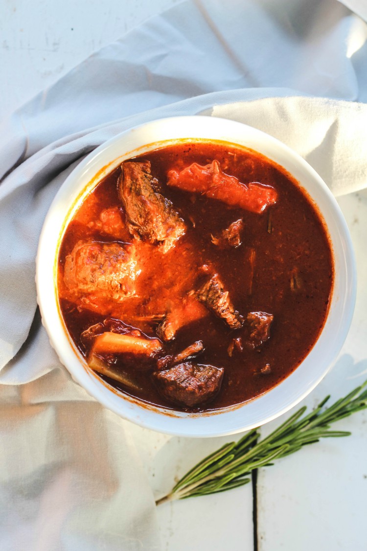 overhead image of beef stew in white bowl