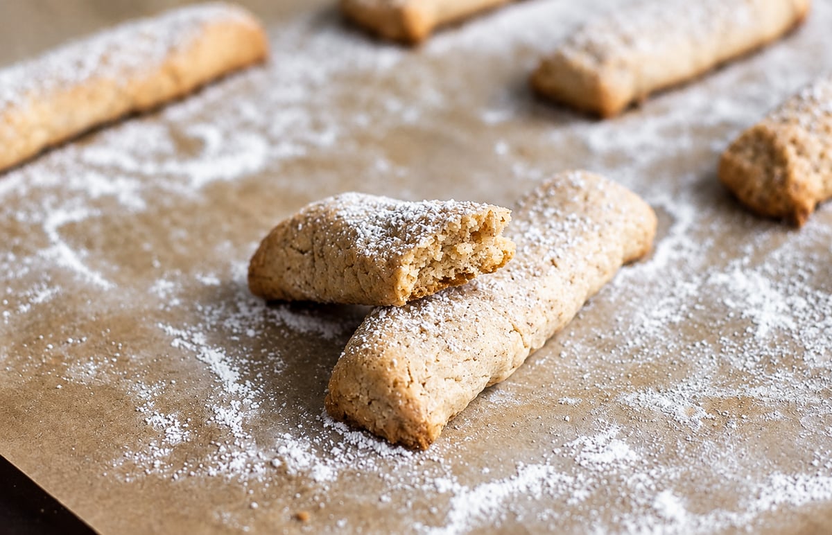 Bones of the Dead Cookies-Ossa di Morto Close-up of bones of the dead cookies dusted with confectioner's sugar