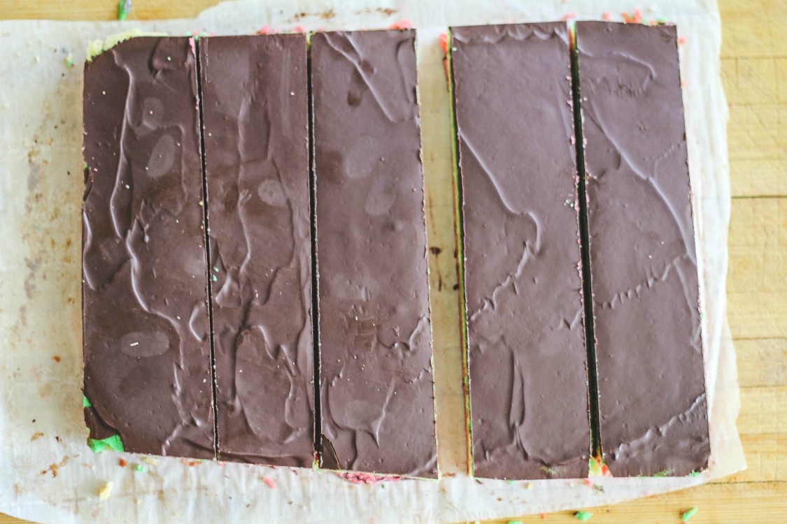 overhead image of cake with chocolate icing sliced