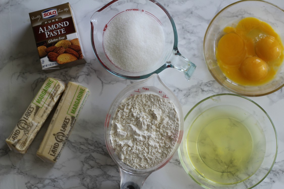 overhead image of baking ingredients on marbled background