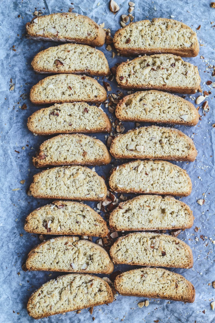 over head image of biscotti with nuts on baking tray