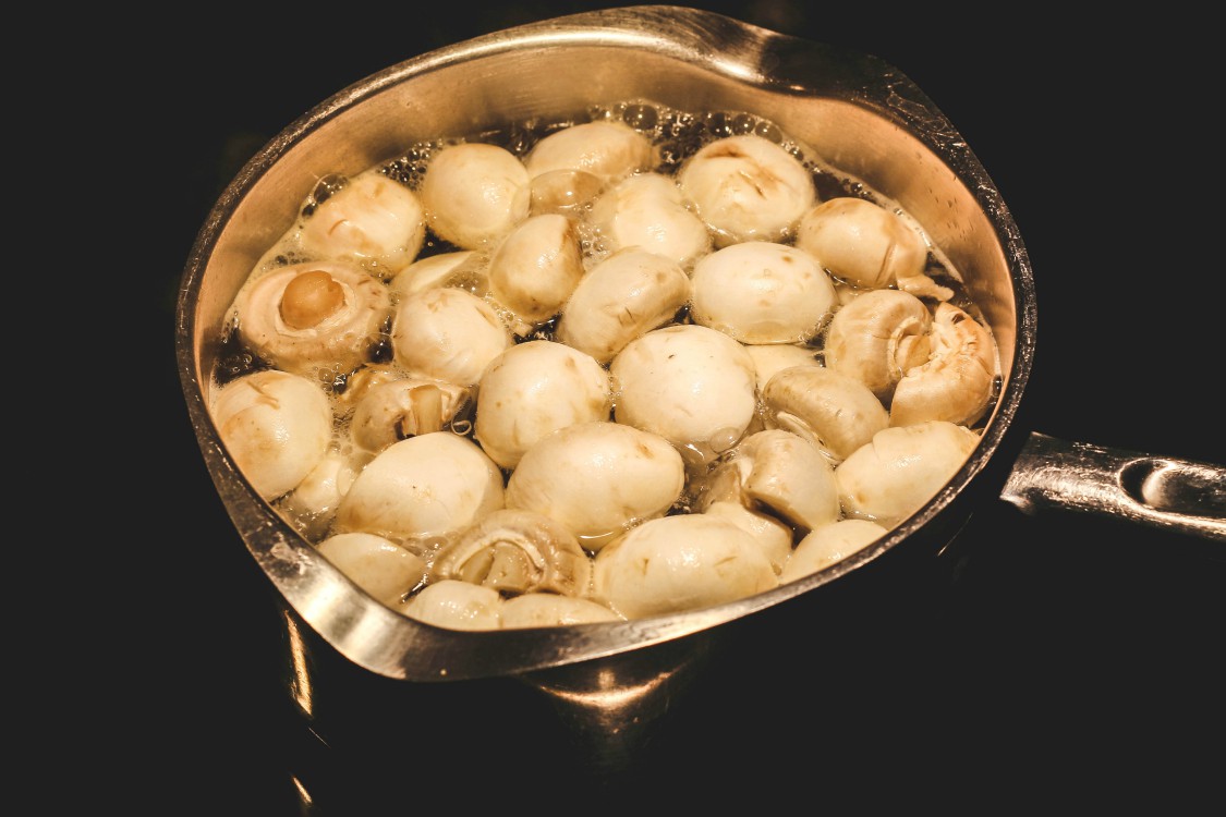 overhead image of mushrooms cooking.