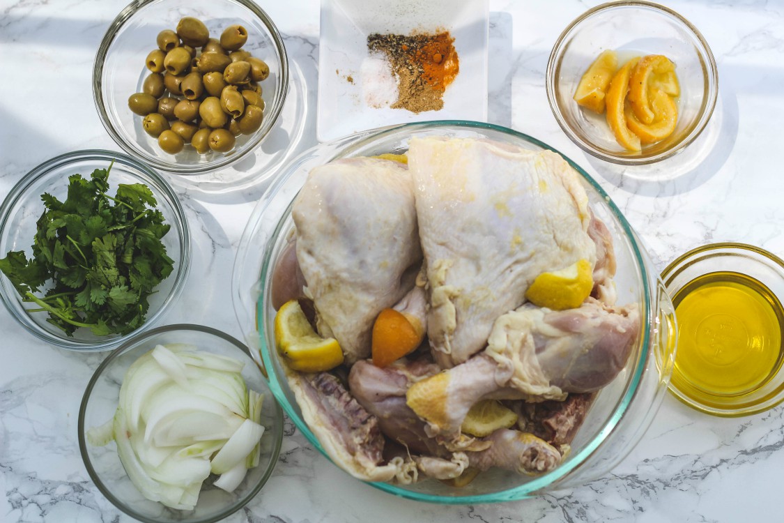 overhead image of making chicken with preserved meyer lemons and olives
