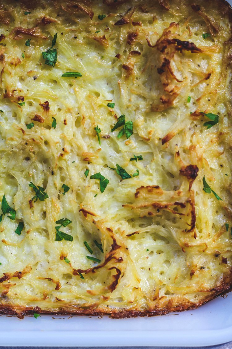 overhead image of potato dish with parsley sprinkled on top