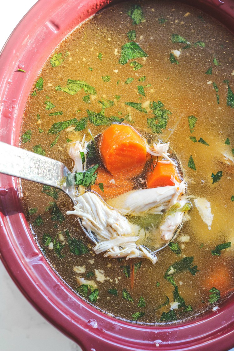 overhead image of chicken soup in slow cooker
