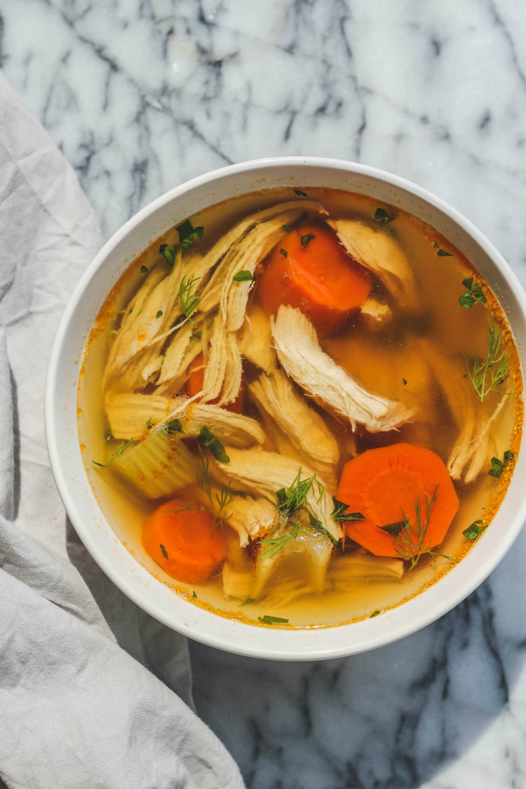 overhead image of bowl slow cooker whole chicken soup