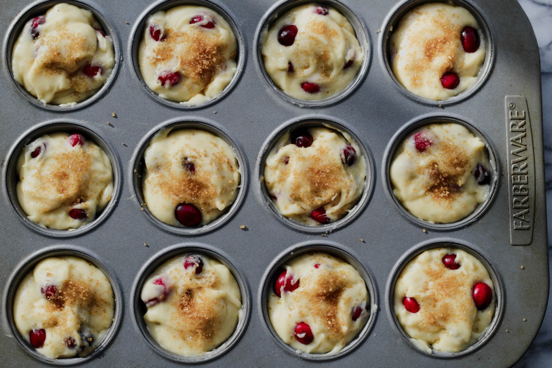 image of cranberry muffins in a baking pan