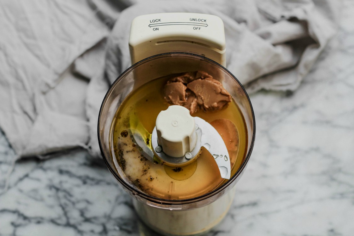 overhead image of making tahini lemon dressing.