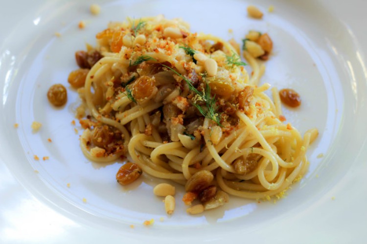 overhead image of pasta con le sarde on a white plate