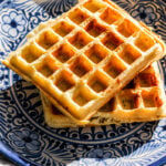 Marion Cunningham waffles on a blue plate.
