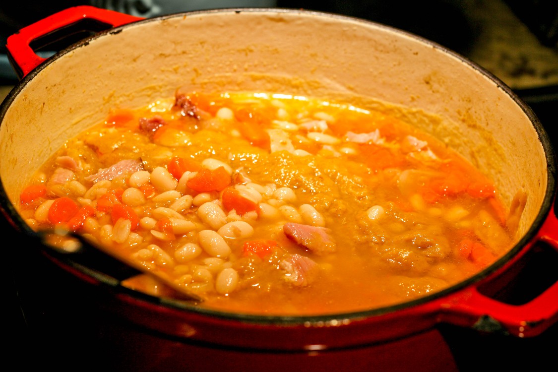 image of Hungarian ham and bean soup in a red pot
