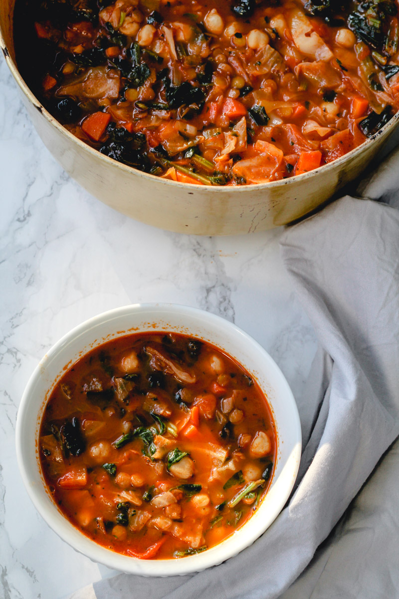 overhead image of chickpea stew with spinach in a bowl 