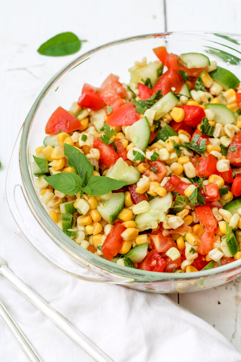 overhead image of vegetable salad in a glass bowl