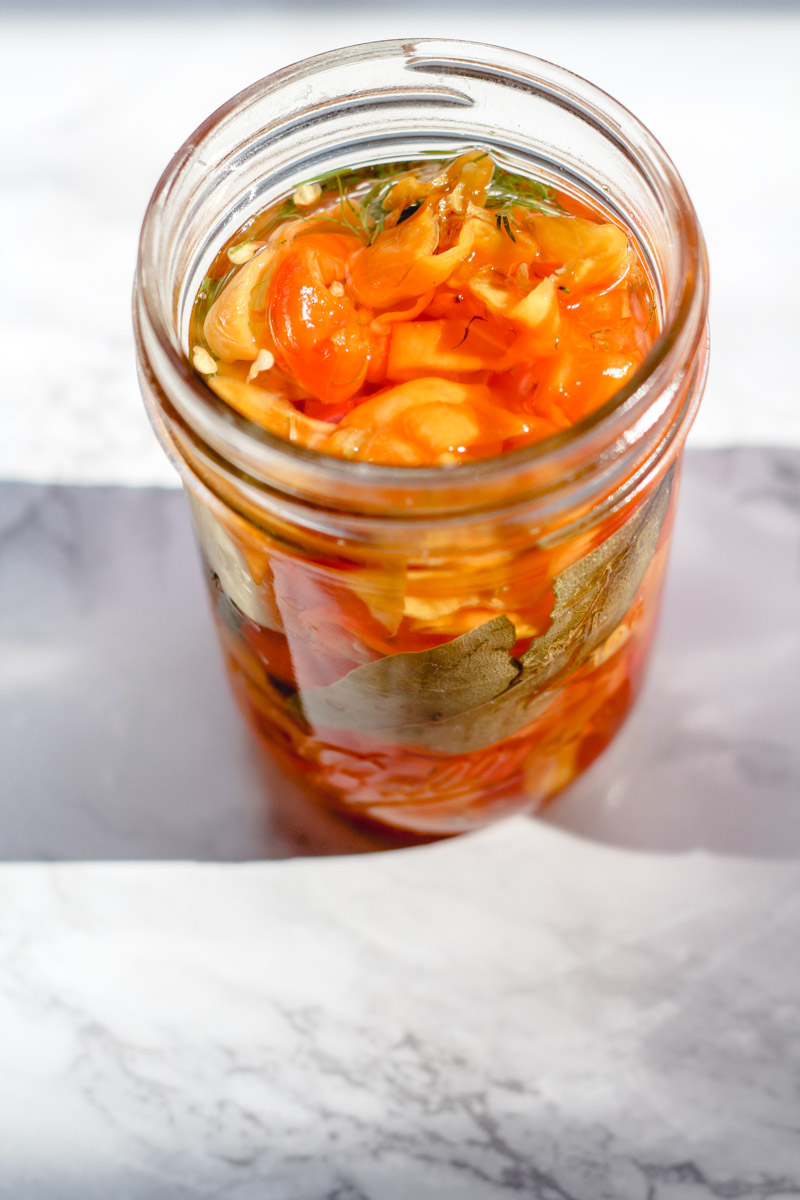 image of pickled scotch bonnet peppers in a jar